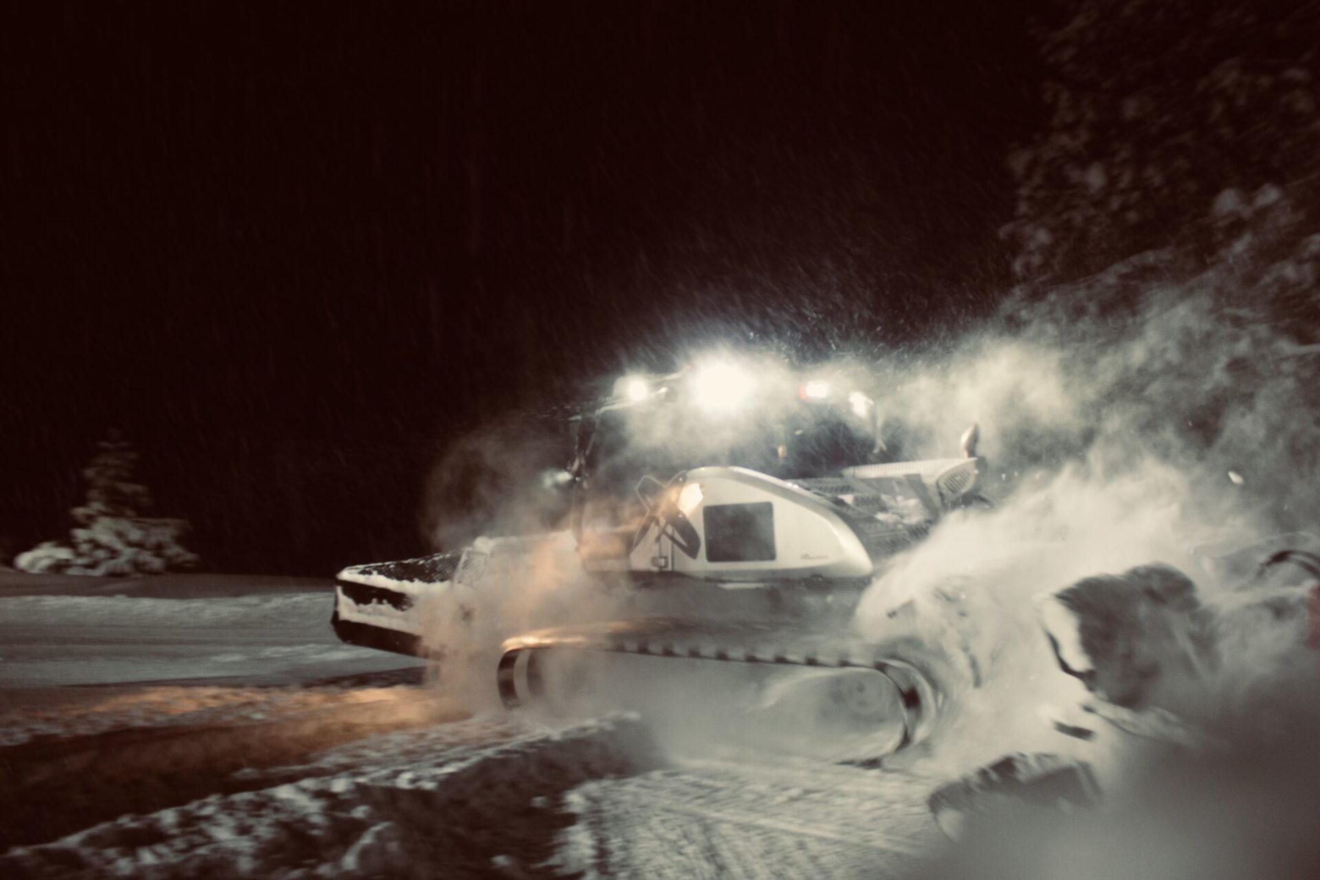 KJ operating a snow cat in night-shift high-country conditions