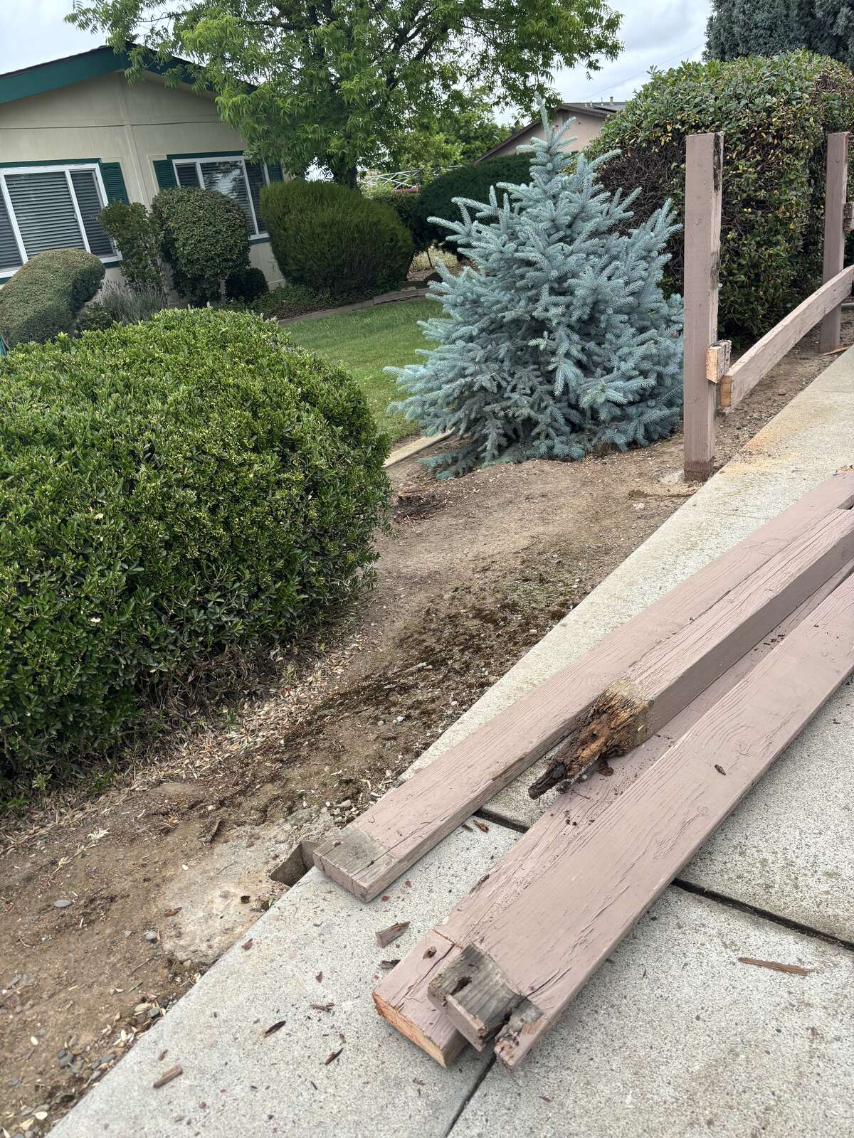 CKJ Ag Services pulling out a rotted wood fence line for replacement